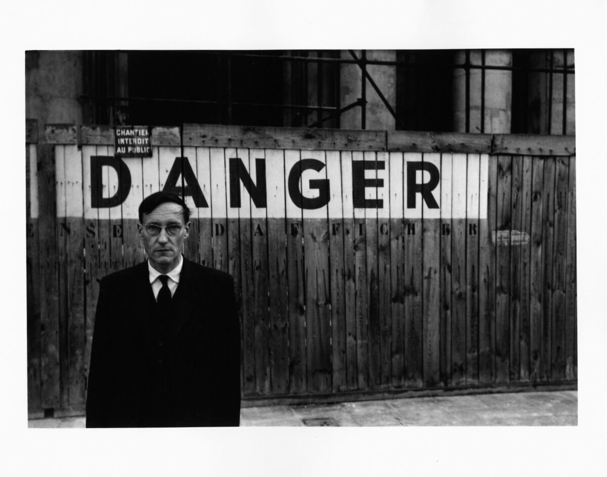 Portrait of William S Burroughs in front of the Théâtre Odeon, 1959. © Brion Gysin, Naked Lunch series, Paris, October 1959 © The Barry Miles Archive