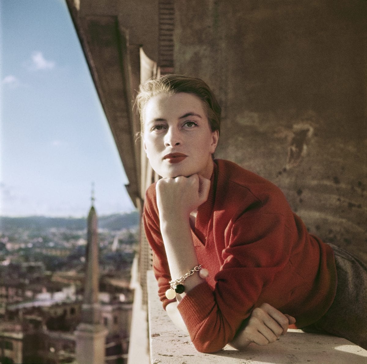 Capucine, French model and actress, on a balcony, Rome, August 1951. ©Robert Capa/International Center of Photography/Magnum Photos.