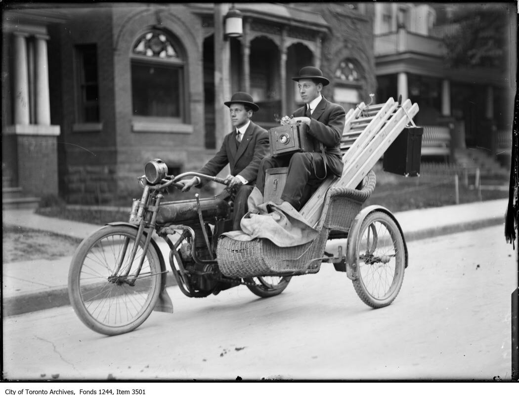 Photographers Bill and Joseph James on a motorcycle. - 1912